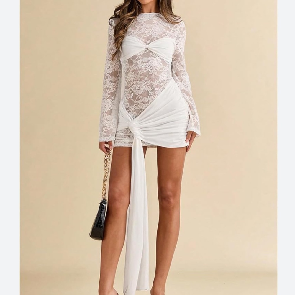 Elegant white lace mini dress. Long sheer lace sleeves and bodice. Twist front b - Picture 1 of 4